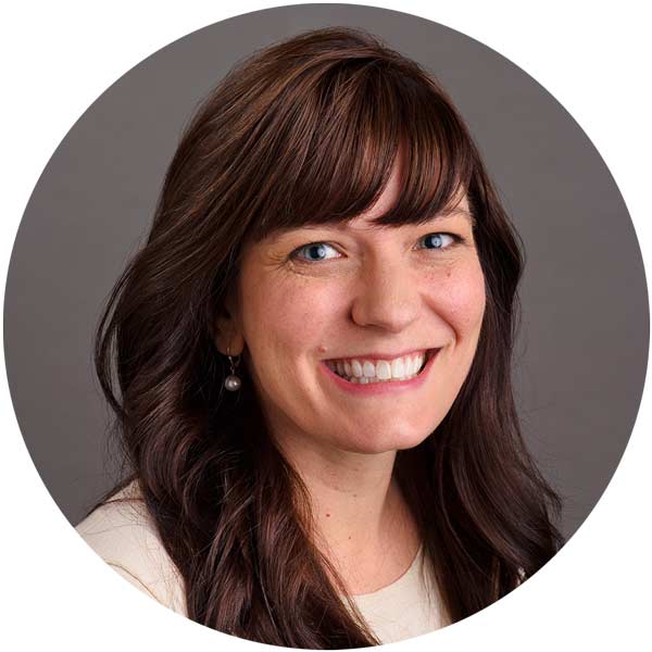 photo portrait of brunette woman with long hair smiling.